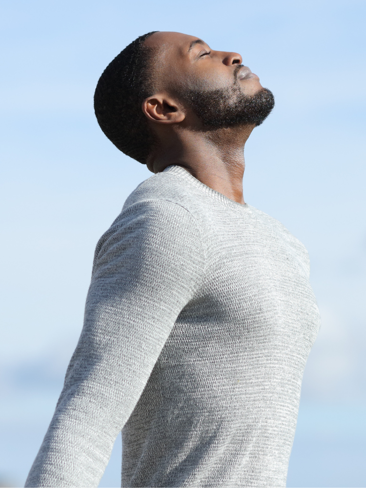 Image of a man breathing in deeply